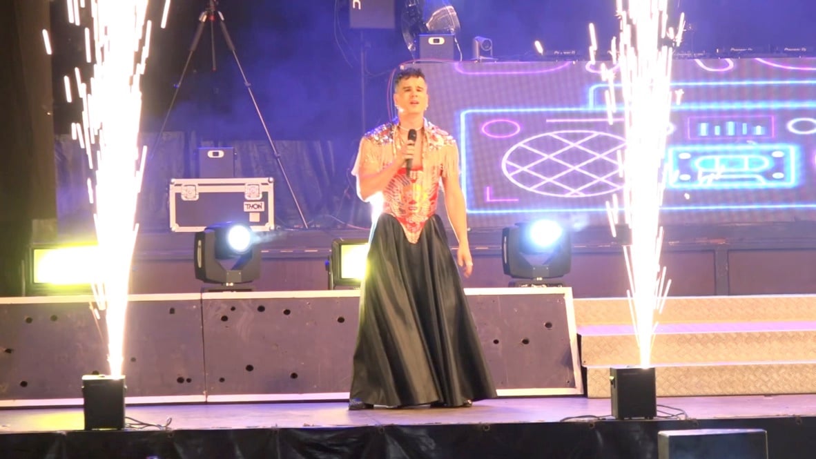 Centre stage as pyro columns fire behind the singer.