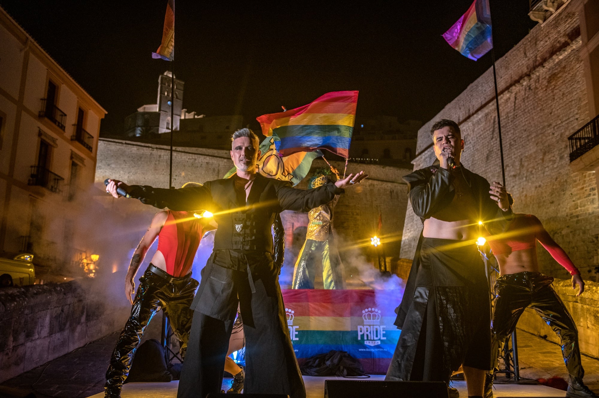Ibiza Pride 2026 — the duo and the four dancers under the pride flags.